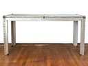An Unusual And Awesome Vintage Aluminum Clad Parsons Table