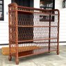 A Vintage Bookshelf With Woven Reed Back