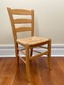 A Ladder Back Side Chair With Rush Seat