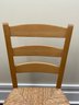 A Ladder Back Side Chair With Rush Seat