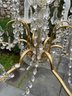 A Crystal And Brass Chandelier