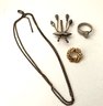 Miscellaneous Lot: Necklace With Sterling Clasp, Size 8 Steel Ring Marked Old New York, 2 Pins Brooches