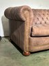 A Leather Chesterfield Sleeper Sofa By The Janess Furniture Company