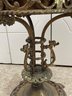 An Antique Plant Stand With Copper Cache Pot