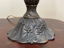 A Bronze Accent Lamp With Stained Glass Shade