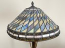 A Vintage Art Nouveau Style Standing Lamp With Stained Glass Shade