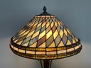 A Vintage Art Nouveau Style Standing Lamp With Stained Glass Shade