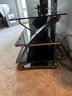 Metal And Glass TV Stand With Three Graduating Shelves