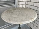 An Antique Cast Iron And Marble Bistro Table