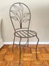 A Pair Of Vintage Wrought Iron Chairs - Leaf Pattern On Back