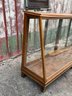 A Late 19th Century Oak And Glass Display Case By Columbus Show Case Company