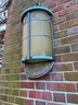 An Exterior Copper And Glass Sconce