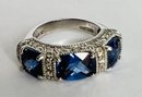 BEAUTIFUL STERLING SILVER SYNTHETIC TANZANITE AND WHITE STONES RING