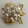 VINTAGE GOLD TONE AURORA AND FAUX PEARL BUG BROOCH