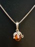 STERLING SILVER ELEPHANT ON AMBER BALL NECKLACE