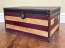 An American Flag Themed Trunk With Leather Banding