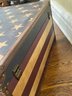 An American Flag Themed Trunk With Leather Banding