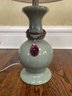A Ceramic Accent Lamp With Jewel Tone Charms