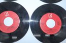 4 Vinyl Records 45RPM Including Queen & Foreigner