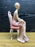Pair Of Resin 1920s Style Seated Flapper Girl Statue Figures.