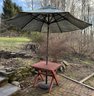 A Charming Little Redwood Dining Table With Umbrella