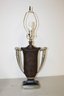 A Trophy Style Lamp With Suede Shade