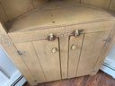 A Rustic Painted Wood Corner Cabinet By Lillian August