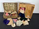 TWO MINIATURE DOLL TRUNKS WITH CLOTHES