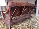 A Vintage Seaside Rattan Sofa With Tropical Print Cushions From Mystic Wicker