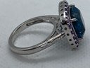 Very Fine Sterling Silver Ring With A Large Faceted London Blue Topaz Center Stone And Amethyst Surround
