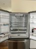 A Stainless Steel Whirlpool French Door Refrigerator - Guest House