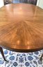 A  Vintage Baker Furniture Oval Dining Table With One Leaf.