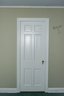 A Collection Of 18 Original To House 1.75' Thick Solid Wood 6 Panel Doors With Brass Hardware