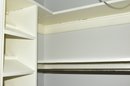 A Collection Of Wood Built In Shoe Caddies And Closet Shelving
