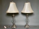 A Pair Of Vintage Cut Glass & Silver Toned Lamps