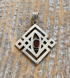 Sterling Silver And Garnet Celtic Knot Pendant