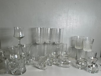 A Large Collection Of Plastic & Glassware