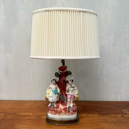 A Porcelain Figural Lamp