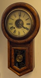 A Vintage Eight Day Movement Wall Clock With Key