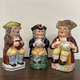 A Trio Of Antique Staffordshire Toby Jugs