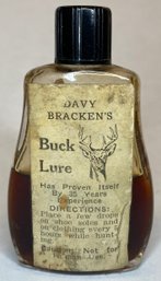 Vintage Old Glass Bottle Of Davy Brackens Buck Lure - 35 Years Experience - Hunting Memorabilia