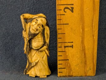 Carved Netsuke Of Man With Staff