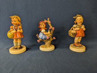 Lot Of 3 Hummel / Goebel West Germany Figurines School Girl, Apple Tree Girl, & Little Shopper