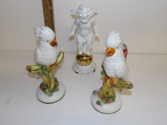 Pair Italian Glazed China Parrots And A Glazed And An 11'gilt Putti Frauereuth Wallendorf