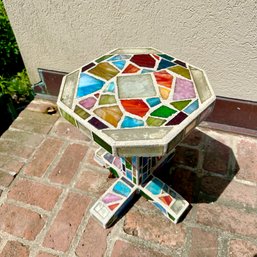 A Poured Concrete 1 Piece Table With Irridiscent Glass Pieces