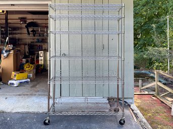 Modular Shelving Unit With Six Shelves On Casters