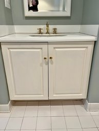 A Corian Topped Wood Vanity