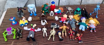 131. Small Assorted Action Figures Disney And Rugrats