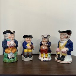 An Assortment Of 4 Antique Staffordshire Toby Jugs