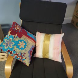 Two Colorful Throw Pillows From The Client Reception Area